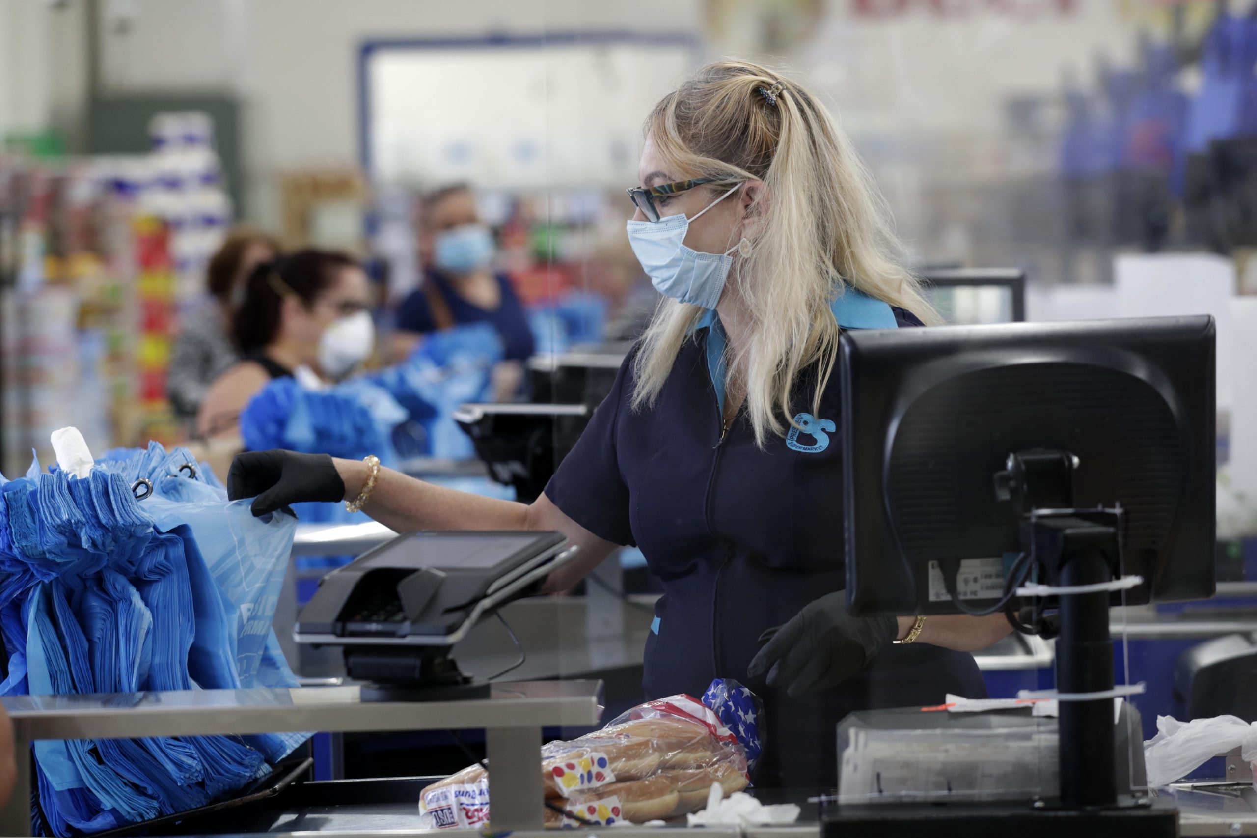 grocery cashier working with mask on